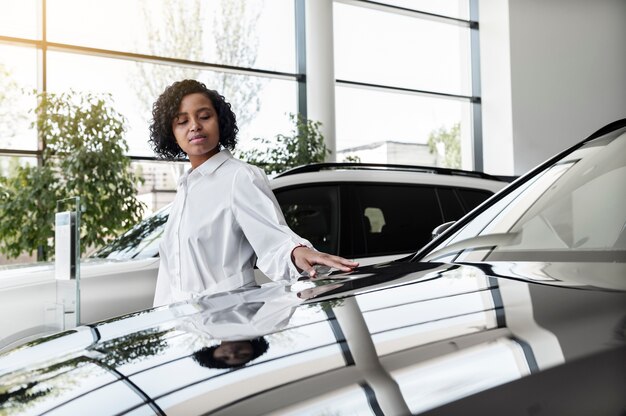 Woman enjoying her financially independence while buying car