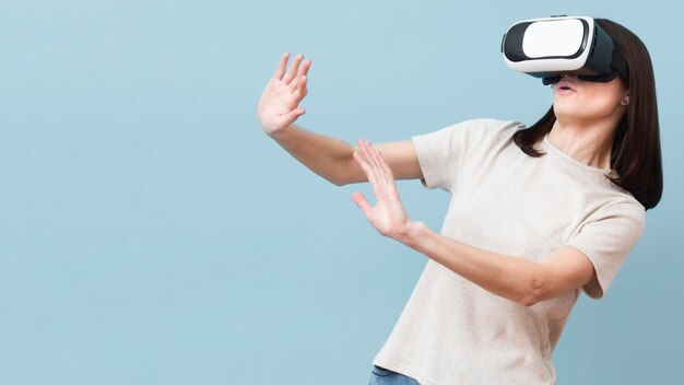 Woman enjoying her time while using virtual reality headset