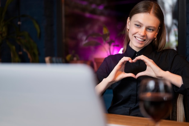 Free photo woman enjoying her virtual date