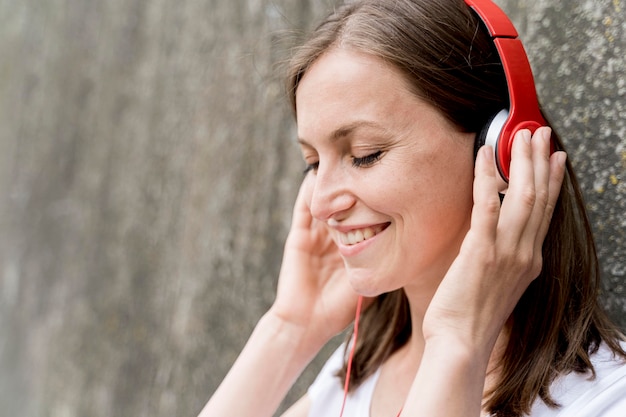 Woman enjoying music in headphones