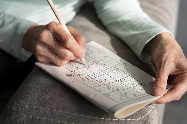 Woman enjoying a sudoku game by herself