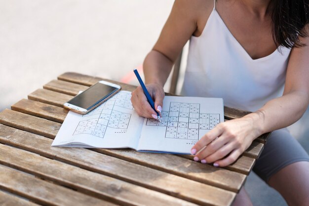 Woman enjoying a sudoku game by herself