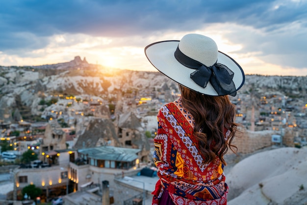 Free Photo woman enjoying view of goreme town, cappadocia in turkey.