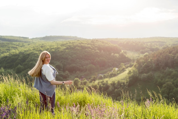 Free photo woman enjoying the view of nature