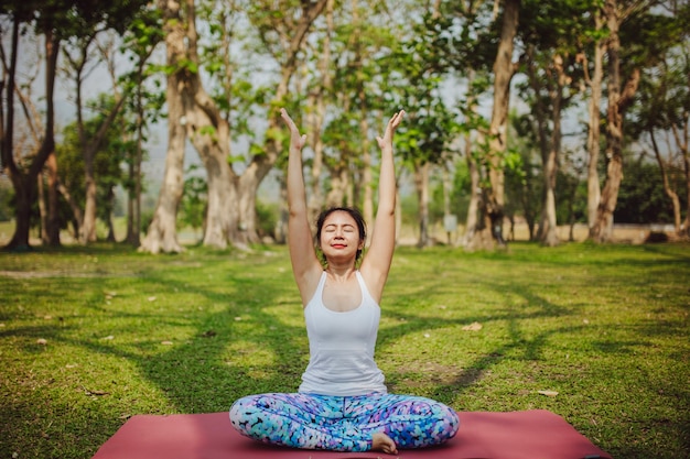 Free photo woman enjoying yoga and sunny day