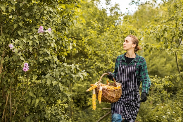 Free Photo woman farmer with a basket