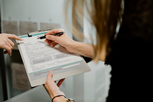 Free photo woman filling out a form