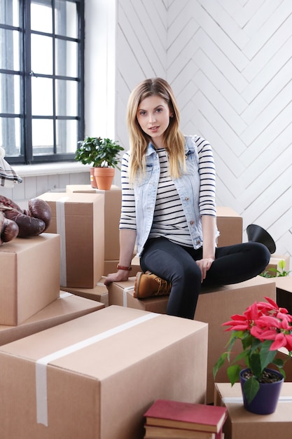 Free Photo woman finished with cargo packages and is ready to shipping or moving