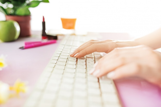 Free photo woman and fruit diet while working on computer in office