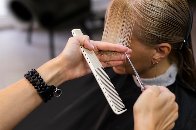 Woman getting her hair cut at the beauty salon