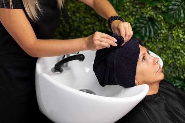 Woman getting her hair done at the beauty salon