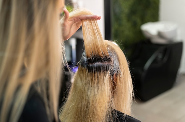 Woman getting her hair dyed at the beauty salon