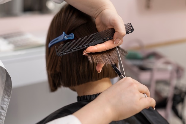 Woman getting treatment at hairdresser shop