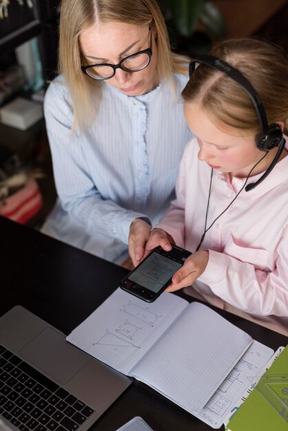 Woman and girl doing homework