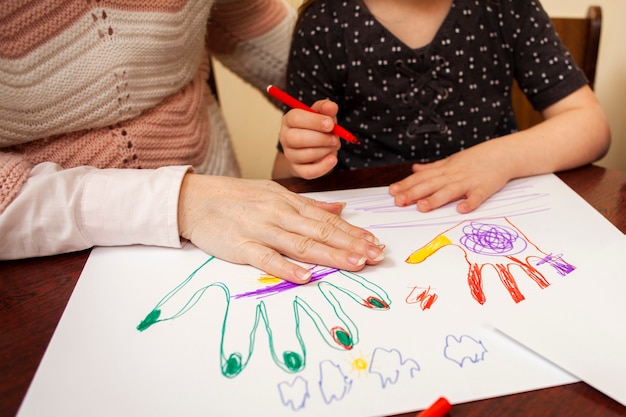 Free Photo woman and girl drawing