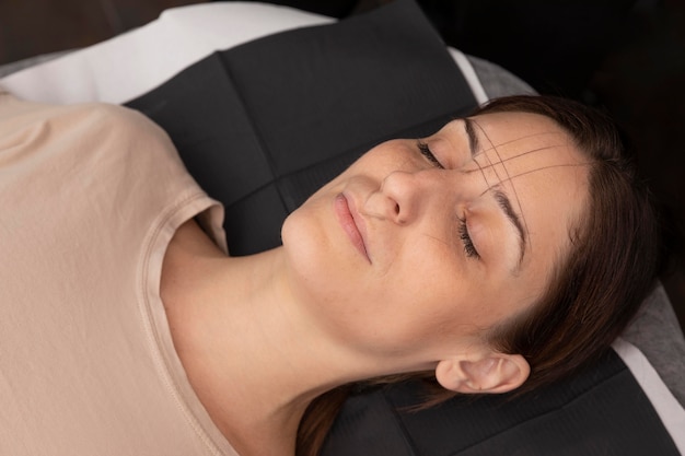 Woman going through a microblading procedure