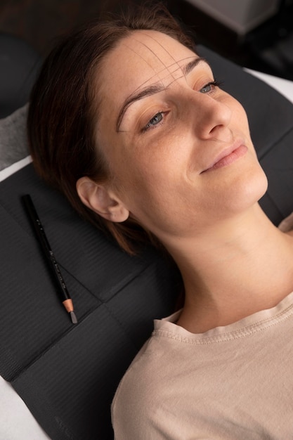 Woman going through a microblading procedure