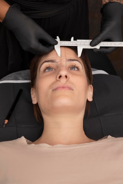 Woman going through a microblading procedure