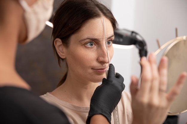 Free photo woman going through a microblading procedure