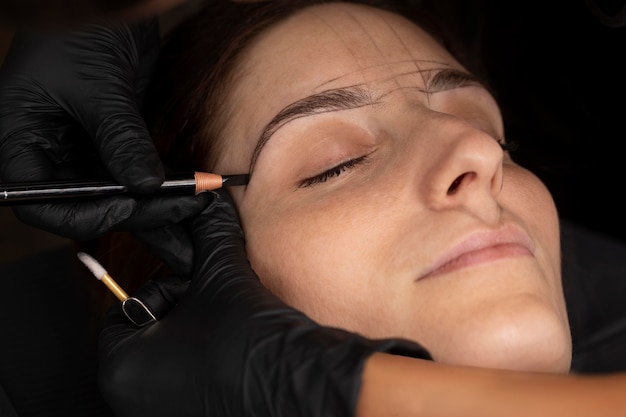 Woman going through a microblading treatment