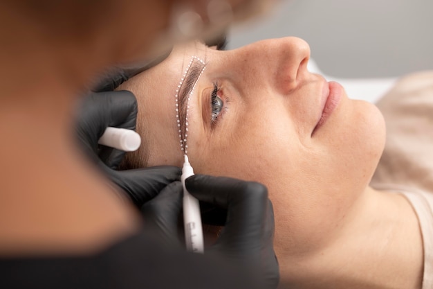 Woman going through a microblading treatment