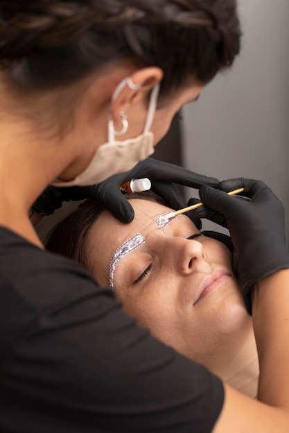 Woman going through a microblading treatment