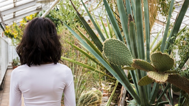 Free photo woman in greenhouse