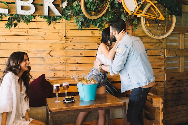 Woman greeting man