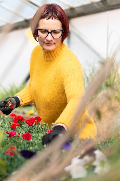 Free photo woman growing plants