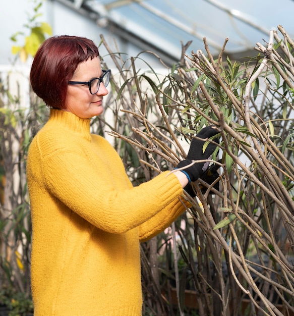 Free photo woman growing plants