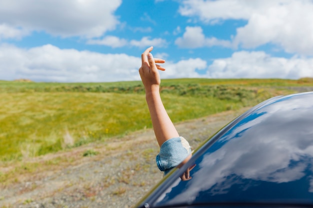 Woman hand against backdrop of nature