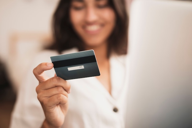 Woman hand holding a credit card