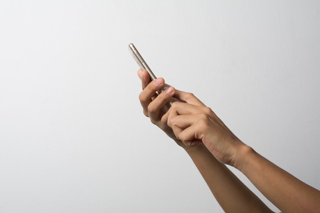 Woman Hand holding smart phone blank screen. Copy space. Hand holding smartphone isolated on white background.