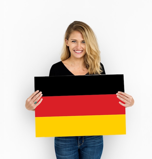 Free photo woman hands hold germany deutschland flag patriotism