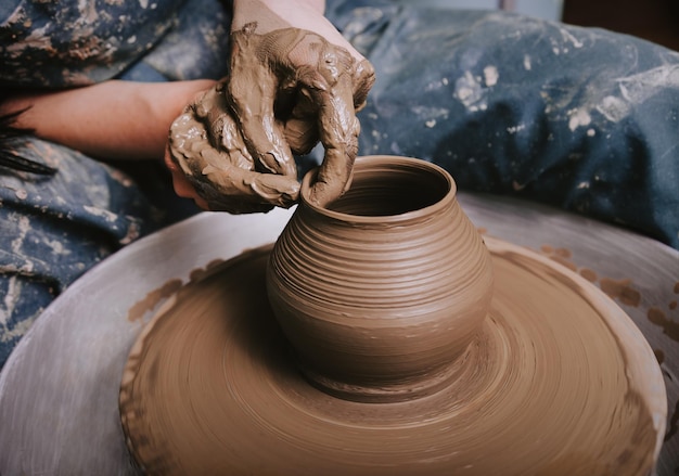 Woman hands making pottery