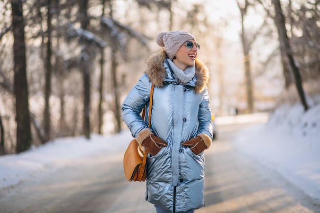 Woman happy walking in a winter park