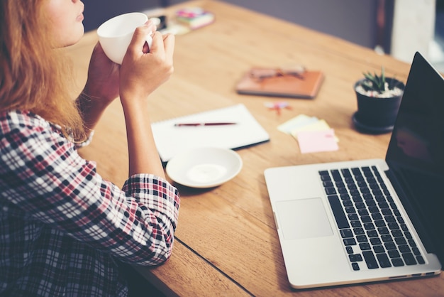 Woman having a coffee at work