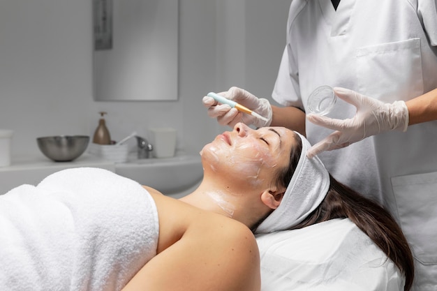 Woman having a facial treatment