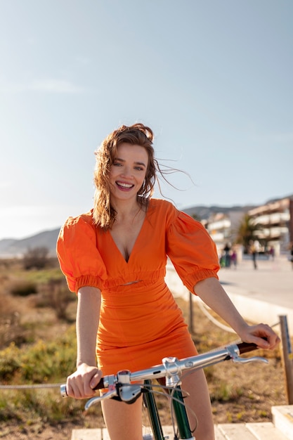 Woman having fun with friends by the sea