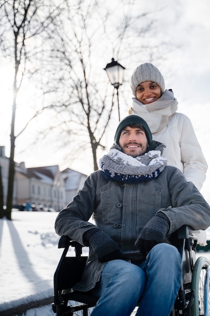 Woman having fun with her her disabled friend