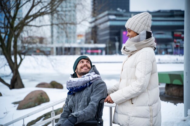 Woman having fun with her her disabled friend