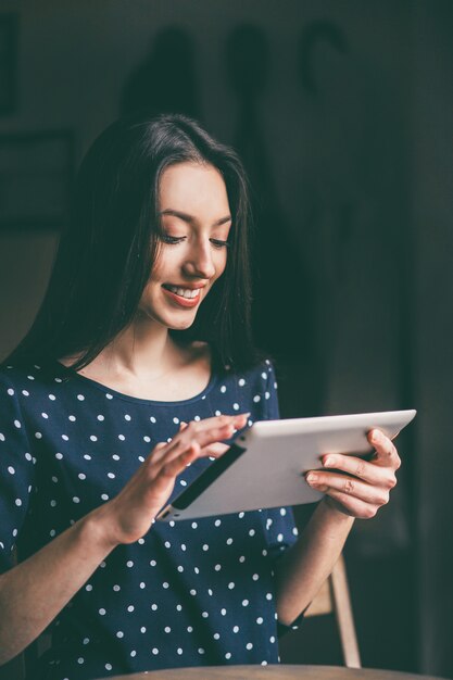 Woman having a good time with her tablet