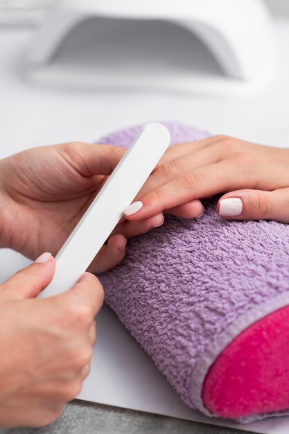 Woman having her manicure done