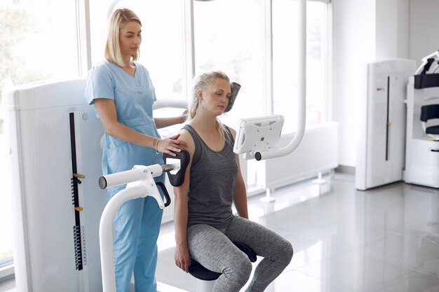 Woman having rehabilitation after injury in physiotherapy room