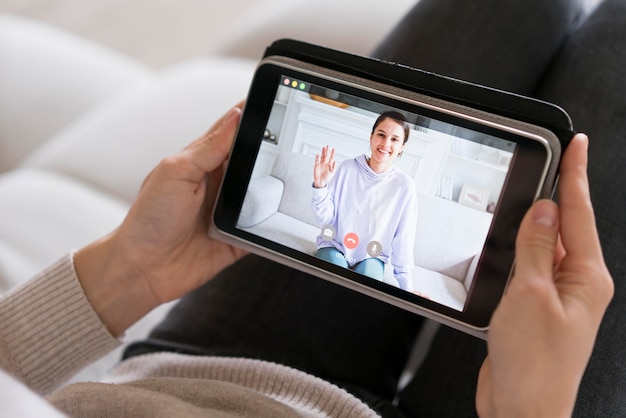 Free Photo woman having a video call on her tablet