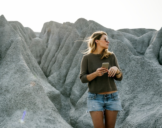 Woman hiking to the top of mountain in nature