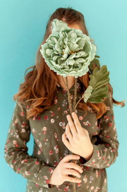 Woman holding beautiful flower