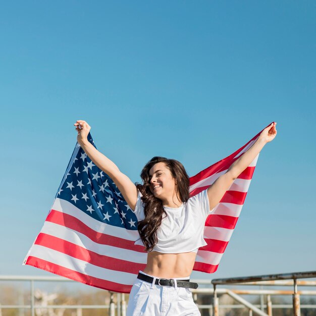 Woman holding big usa flag