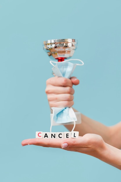 Woman holding a canceled message made from little cubes