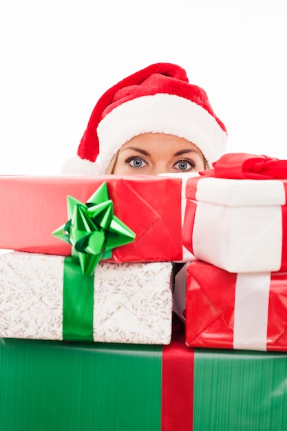 Free Photo woman holding christmas present in front of face